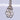 Detailed close-up of rose cut diamonds and milgrain design in antique Edwardian earrings