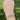 Emerald and diamond bracelet worn on wrist outdoors – handmade New Orleans bracelet from HGM Jewelry