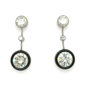 Pair of diamond earrings on a white background