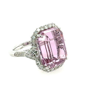 Ring with a Kunzite gemstone and diamond accents on a white background