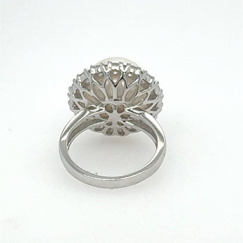 White South sea pearl and diamond ring  win an intricate 18k white gold ring on a white background 