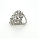 Side profile of antique platinum Art Deco ring with center diamond and filigree details