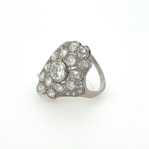 Side profile of antique platinum Art Deco ring with center diamond and filigree details