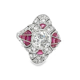 Art Deco platinum cocktail ring with diamond center and calibre cut rubies