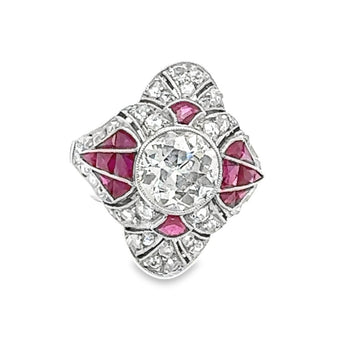 Art Deco platinum cocktail ring with diamond center and calibre cut rubies