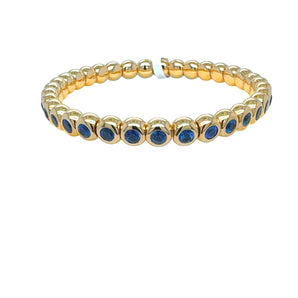 Stretch blue sapphire bracelet in 18k yellow gold – handcrafted stackable jewelry from HGM Jewelry New Orleans