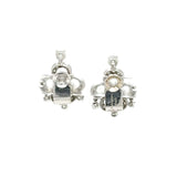 Detailed close-up of antique Boucheron diamond earrings – Estate jewelry from HGM New Orleans