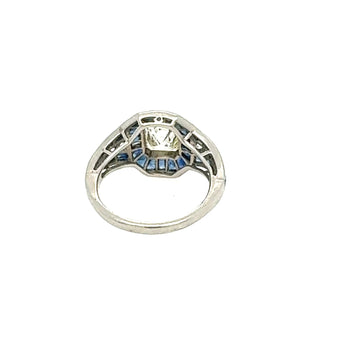 Detailed band view of calibre-cut sapphire and emerald-cut diamond ring – antique jewelry New Orleans