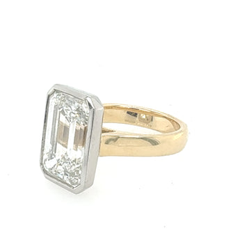 Side view of emerald cut diamond ring in gold setting – HGM Jewelry New Orleans
