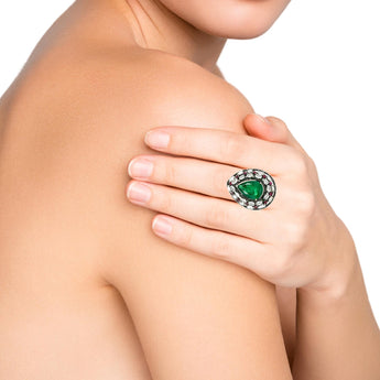 Pear-shaped emerald and diamond ring worn on hand – New Orleans fine jewelry by HGM