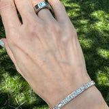 Flatlay image of Art Deco diamond line bracelet with round and marquise-cut diamonds set in platinum