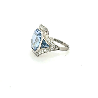 Platinum blue sapphire ring with diamond halo setting – luxury engagement ring at HGM Fine Jewelry New Orleans