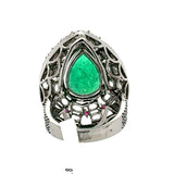 Angled close-up of pear shape emerald ring with diamond and ruby halo – HGM Jewelry