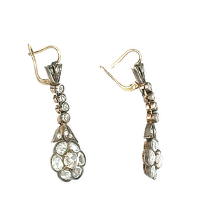 Side view of Edwardian drop earrings showing lever backs and intricate diamond setting in two-tone metal