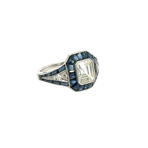 Side profile of vintage platinum ring with emerald-cut diamond and blue sapphires – New Orleans fine jewelry