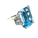 Angled profile of aquamarine gemstone ring with brilliant cut diamonds