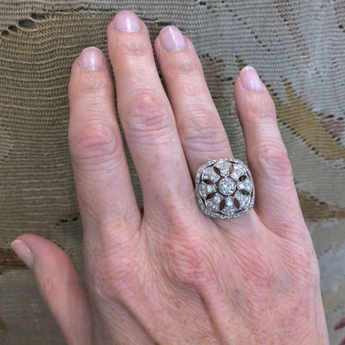 Art Deco diamond filigree ring worn on hand, reflecting vintage New Orleans style and elegance
