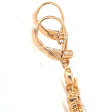 Side profile of diamond drop earrings in 18K rose gold with delicate rose-cut stones