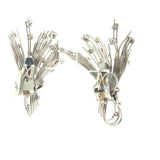 Side angle of diamond spray earrings in white gold with round brilliant cut diamonds
