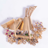 Horizontal angle of flower brooch with brilliant diamonds and mixed gemstones in radiant Art Deco design