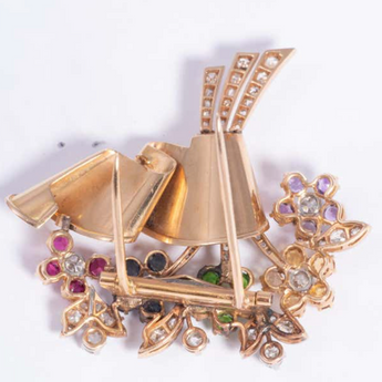 Horizontal angle of flower brooch with brilliant diamonds and mixed gemstones in radiant Art Deco design